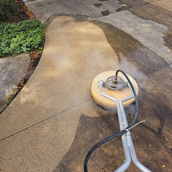 Pressure washing a concrete surface